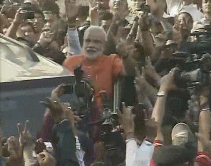 Big smile on face and holding up a V for victory, Mr Modi wants another record turnout.