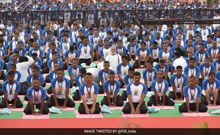 The Prime Minister is seen performing yoga with thousands of people in Chandigarh.