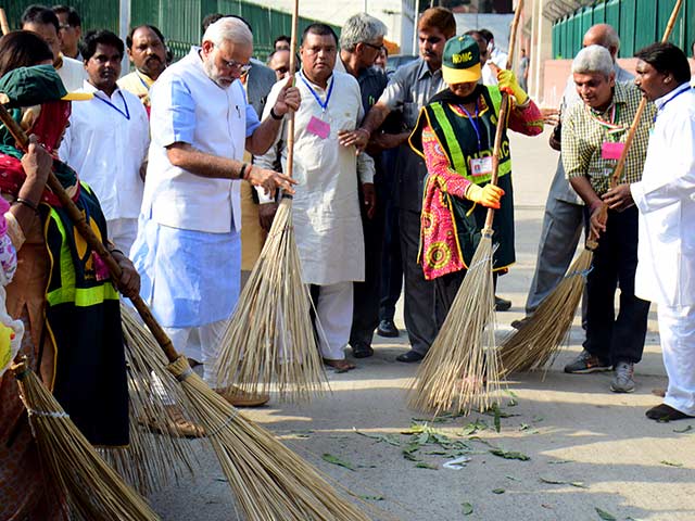 Photo : The PM and a Broom. Clean India Mission Launched.