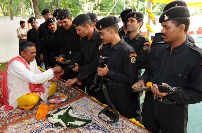 Narendra Modi's <em>Shastra Puja </em>threatens to launch him into a brand-new controversy. <em>Shastra puja </em>is usually performed on the last day of Navratra, known as Vijay Dashami. The chief minister's security and senior police officers stood by, unarmed since their guns were reportedly a part of the puja. (AFP Photo)