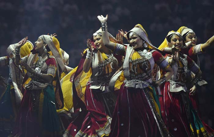 Traditional dancers perform before the arrival of PM Modi. (Agence France-Presse Photo)