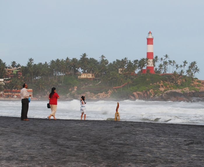 <b>Height-wise: </b>A family stands at a beach as the tides rage on. (Image: Ketki Angre)