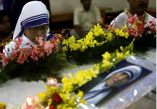 <span class="lh16 fa fs12 fb">In this file photo, a nun of the Missionaries of Charity prays during the celebration of the 98th birth anniversary of Mother Teresa around her tomb at the Mother House of the Missionaries of Charity in Kolkata on August 26, 2008.<br />
<br />
The Society of Missionaries has spread all over the world to provide effective help to the poorest of the poor in a number of countries in Asia, Africa, and Latin America. They also undertake relief work in the wake of natural catastrophes such as floods, epidemics, and famine, and for refugees. The order has houses in North America, Europe and Australia, where they take care of the homeless and AIDS sufferers. (AFP Photo)</span>