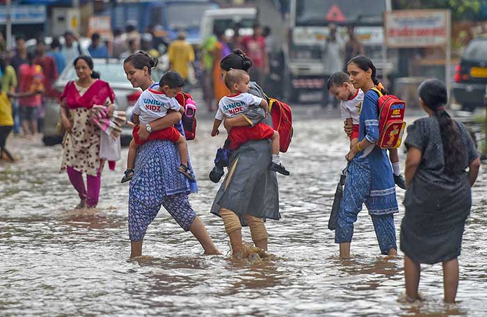 Pics: Monsoon Rains Arrive In Mumbai; People Hassled, But Happy