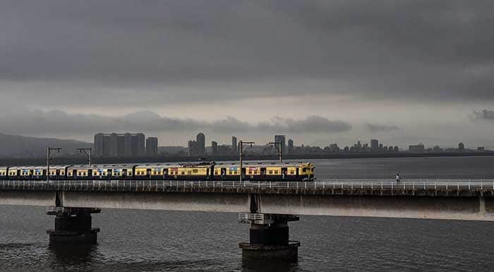 Pics: Monsoon Rains Arrive In Mumbai; People Hassled, But Happy