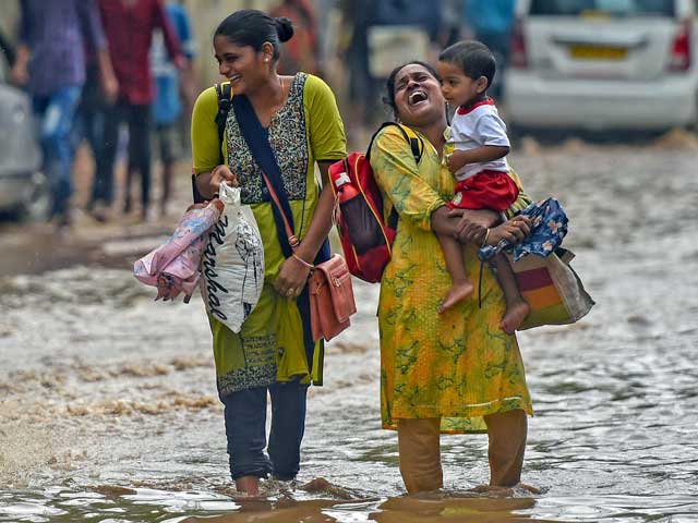 Pics: Monsoon Rains Arrive In Mumbai; People Hassled, But Happy