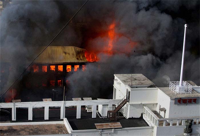 The fire began on the fourth floor of the building at around 2:45 pm and reached the sixth floor where Chief Minister Prithviraj Chavan's office is located. The Chief Minister was inside the building but was rescued. The Chief Minister and Deputy Chief Minister's offices have been heavily damaged in the fire. (Photo courtesy: AFP)