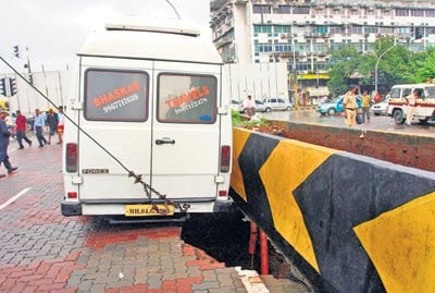 On July 21, 2010, a crater of an approximate size of 15 ft x 20 ft was detected at the Narayan Hardikar Road due to leakage from a corroded storm water pipeline which in turn eroded the soil beneath the road. (Picture: Mid-Day.com)