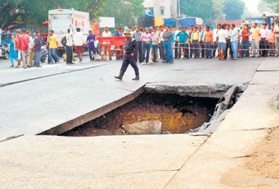 On February 23, 2010, an underground drain collapsed at the Shravan Yashwante Chowk, Kalachowkie creating a crater of an approximate size of 10ftX20ft. (Picture: Mid-Day.com)