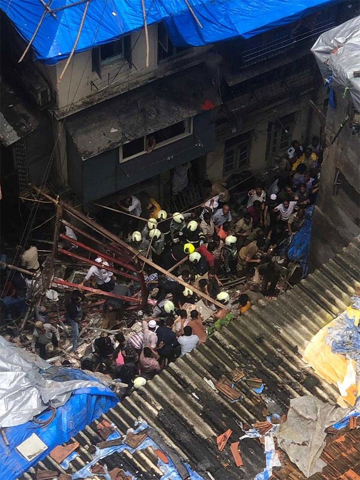 In videos of the rescue operation, NDRF personnel in their bright safety gear are seen trying to remove concrete blocks as they probe the openings amid the debris for signs of life.