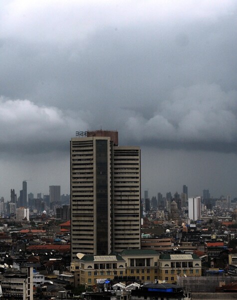 Heavy rainfall is expected to continue in the financial capital of the country with strong gusty winds and thundershowers in parts of city and suburbs, the weather department has said. (AFP Photo)