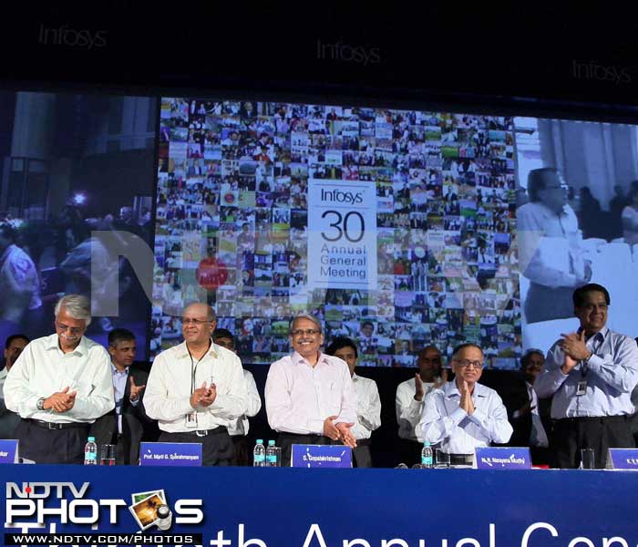 In this pic, outgoing Infosys Chairman N R Narayan Murthy with his successor K V Kamath, CEO K Gopalakrishna and other executives during the company's 30th annual general meeting (AGM) in Bangalore on Saturday. (PTI Photo)