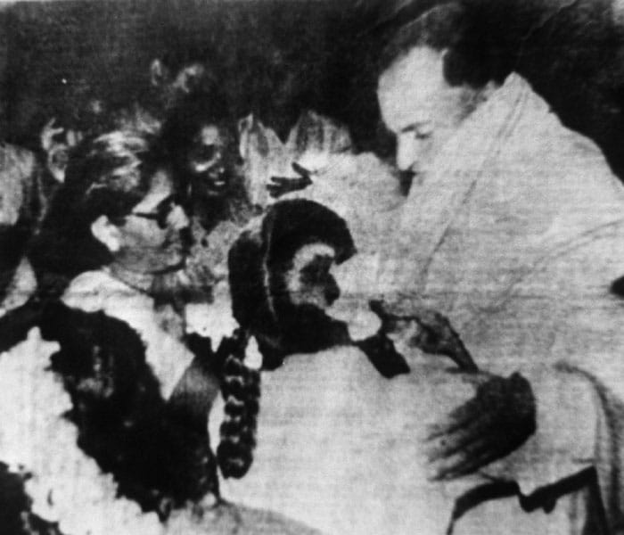 <p>In this picture taken on May 21, 1991, Rajiv Gandhi (R) is greeted as he arrives to make an address during an election campaign moments before he was killed by a suicide bomber in Sriperumbudur in Tamil Nadu. The suspected Tamil guerrilla assassin is in the bottom left corner of the picture with flowers on her head.&nbsp;(AFP Photo)</p>