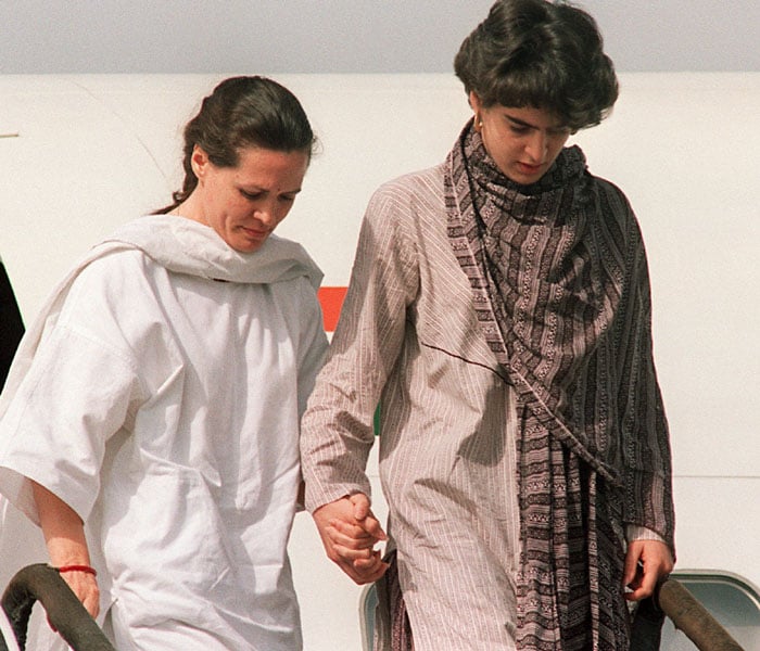 <p>Sonia Gandhi (C), and her daughter Priyanka (R), lead the coffin carrying the remains of Rajiv on an Air Force plane in New Delhi on May 22, 1991.</p>
<p>On May 21, 1991, Rajiv Gandhi, then Prime Minister of India, was assassinated by a woman activist allegedly belonging to Sri Lankan Liberation Tigers of Tamil Eelam (LTTE) rebels. (AFP Photo)<br />
</p>