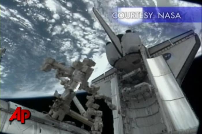 Astronauts in orbit and on the ground practiced on Monday for a major repair job later this week at the International Space Station. A weekend malfunction knocked out half of the space station's cooling system, forcing the crew of six to turn off unnecessary equipment and halt scientific work to avoid any overheating. (AP Photo)