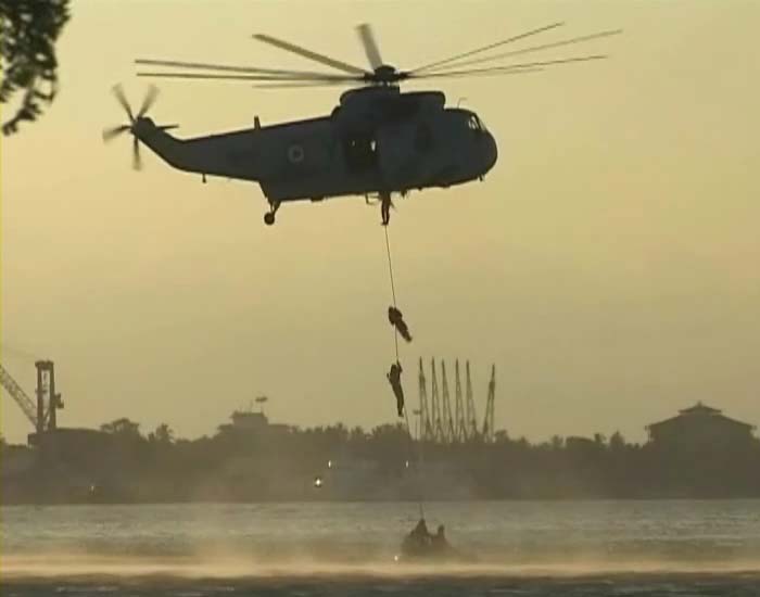 The six-member Indian Navy Sky Diving team displayed their skills by  reaching  their target from a Sea King helicopter.