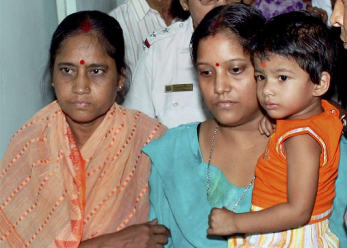 Dutta's wife, Indrani Dutta seen here with her daughter after a meeting with Chief Minister Buddhadeb Bhattacharjee in Kolkata. Indrani had reached out to the goverenment urging them to help her in securing her husband's release. (PTI Photo)<br />