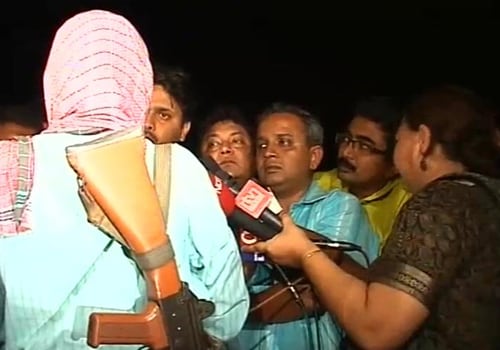 <p>Dutta's abductor, Naxal leader Kishanji held a bizarre photo-op with the media just before releasing him. With his back towards the cameras, he rejected the Centre&rsquo;s conditions for talks, saying surrendering arms cannot be a precondition for talks.</p>
<p>When asked in what condition would he sit for talks, Kishanji said: &ldquo;The first and foremost condition is that they must withdraw all forces from our area.&rdquo; (NDTV Photo)</p>