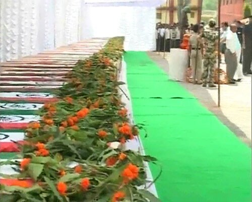 The scene at Jagdalpur was sombre, as coffins were marked out with names of jawans and the places they belong to. Seventy five coffins were lined up for the police ceremony on Wednesday and flags were draped on the slain jawans' coffins.