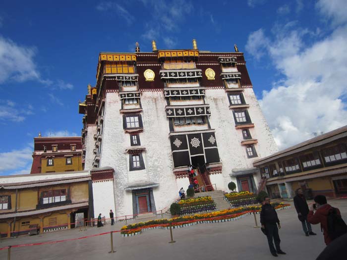 Front view of Potala Palace (Seat of Power of all Dalai Lamas). The Potala Palace in Lhasa, was the chief residence of the Dalai Lama until the 14th Dalai Lama fled to India in 1959. Seat of Power of Dalai Lamas it has the bodies of all but sixth Dalai Lama buried here. Built at an altitude of 3,700 metres, it's divided into White Palace - the administrative wing and the Red Palace - the religious wing.