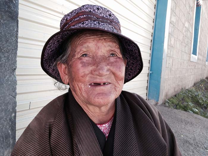 These Eyes Have Seen A Lot. An old Tibetan lady in the model village of Deji.