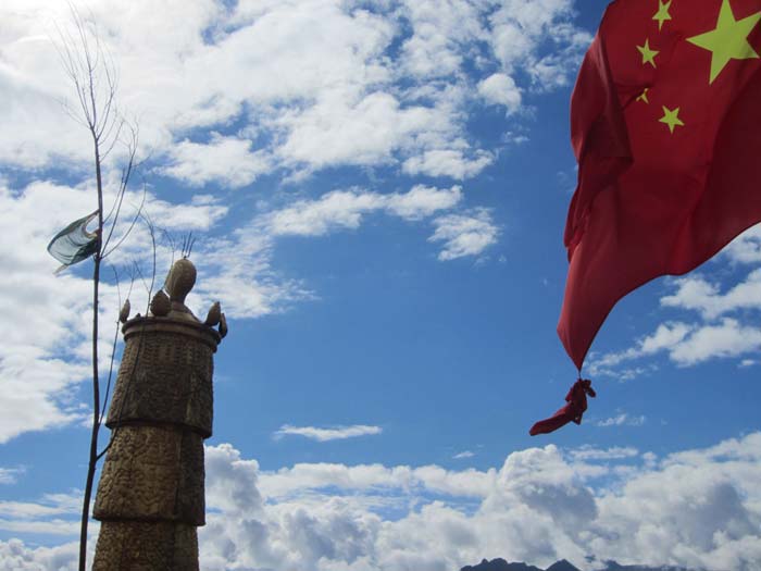 Religion and the State. Almost all buildings - residences, offices, even monasteries and temples fly the Chinese flag.