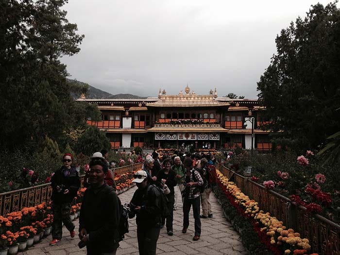 Tourists coming out of Summer Palace of the 14th Dalai Lama at Norbulinka. This place has been preserved and opened for all now.