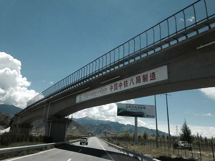 Overbridges and hoardings dot the highway from Shannon to Lhasa.