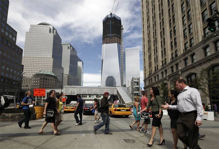 Pedestrians cross a street near the World Trade Centre on Thursday, September 8, 2011 in New York. (AP Photo)