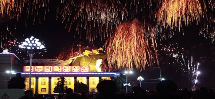 North Koreans gather at the Kim Il Sung Square in Pyongyang, North Korea to watch a fireworks display as they usher in the new year