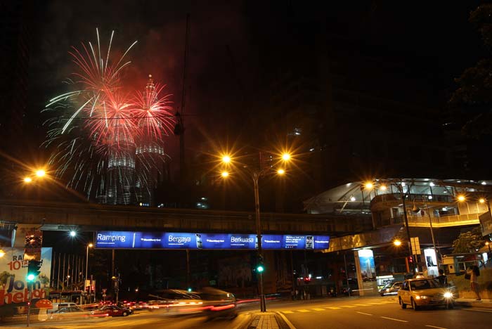 Fireworks burst in the sky near Malaysia's landmark Petronas Twin Towers during the New Year celebrations in Kuala Lumpur on January 1, 2013.</br></br>
Image courtesy: AFP