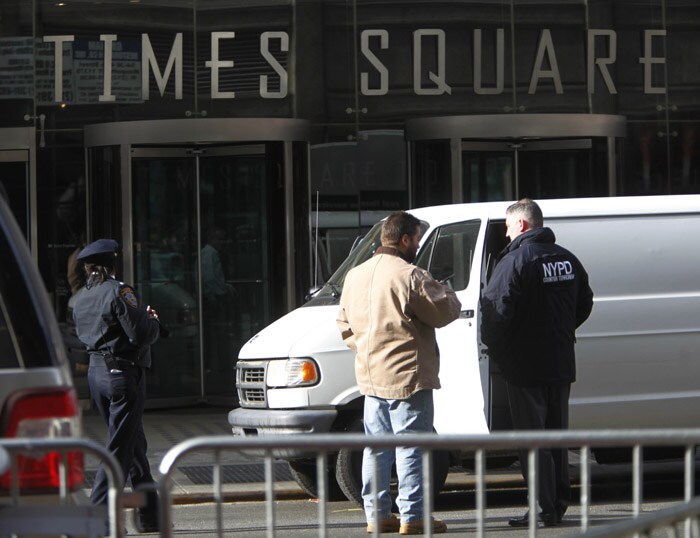 High-rises in New York's Times Square area were partially evacuated on Wednesday, after a bomb scare on the day before New Year's Eve. (AP Photo)