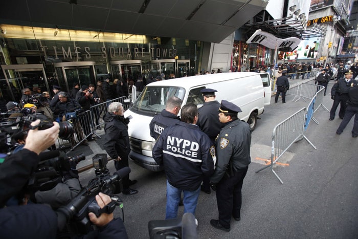 An abandoned white van with tinted windows, no license plates and a non-existent law enforcement agency's sign triggered the alert. (AP Photo)