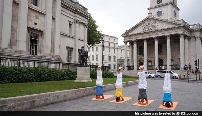 From London to New York, Thousands Roll Out Mats to Perform Yoga