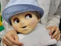 Photo : Japanese scientists unveil baby robot