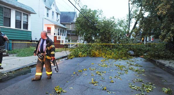 Trees were down on every street in the adjacent neighborhood, blocking traffic and preventing residents from getting in or out of their homes. <br><br>(NYT Photo)