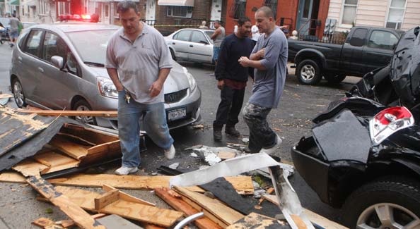 The fast-moving storm, with winds estimated at 60 to 80 miles an hour, caused widespread damage. There were numerous reports of small fires, power failures and damage to homes, stores and vehicles. <br><br>(NYT Photo)