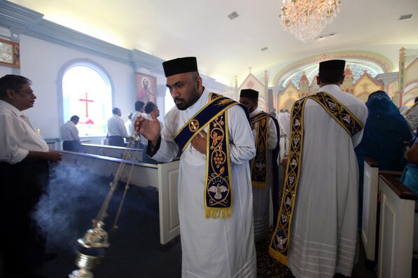 Sunday service at St. Mary's Malankara Indian Orthodox Church in West Sayville, on Long Island, is held before the Assumption Day Parade. (NYT Photo)