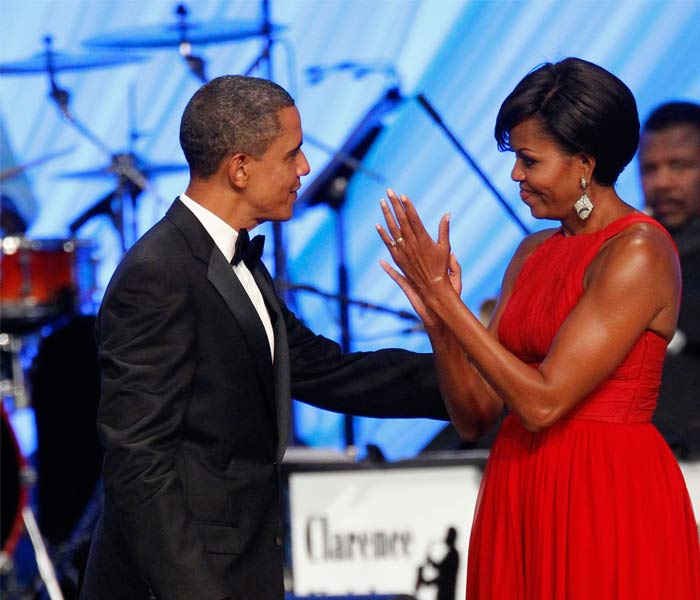 Now, whoever said years of marriage steal away the glory of love, Barack and Michelle Obama surely break all myths. (AP Photo)