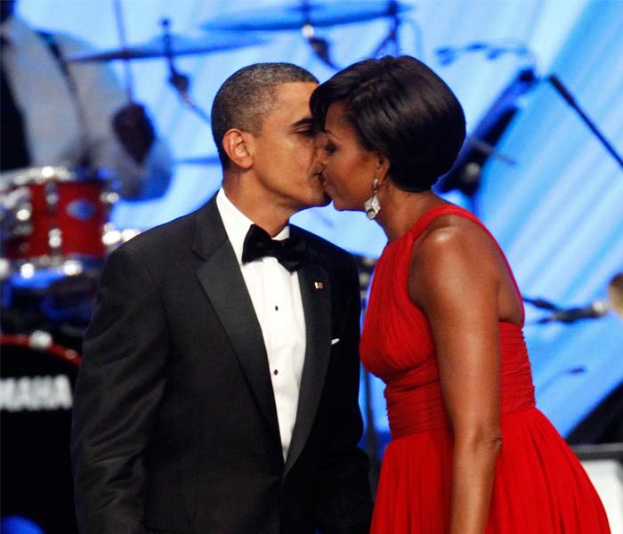 And just before the President was getting ready for his address, the First Lady got in the mood for some public display of affection. Barack and Michelle shared a kiss on stage in front of all the attendees. (AP Photo)