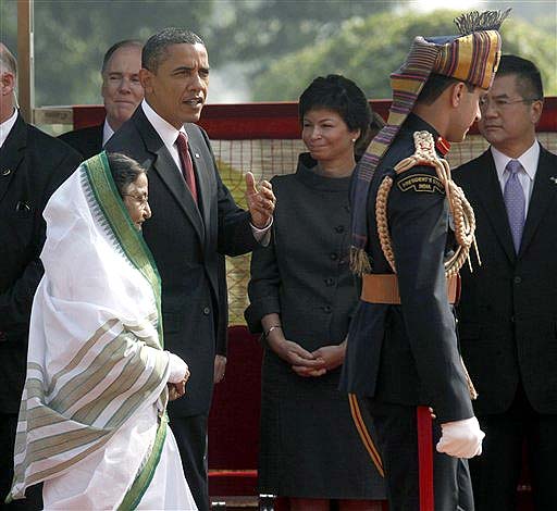 President Barack Obama walks with Indian President Prathiba Patil,during an official arrival ceremony at the Rashtrapati Bhavan in Delhi, India Monday, Nov. 8, 2010. (AP Photo)