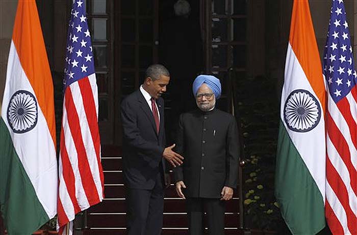 President Barack Obama, extends his hand to Indian Prime Minister Manmohan Singh as he arrives for bilateral talks at Hyderabad House in New Delhi, India, Monday, Nov 8, 2010. Obama is on a three-day visit to the world's largest democracy. (AP Photo)