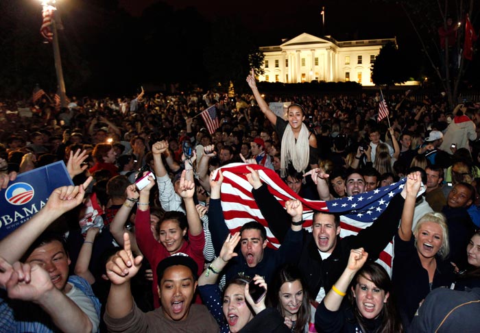 People are seen celebrating as the news breaks out in front of the White House.