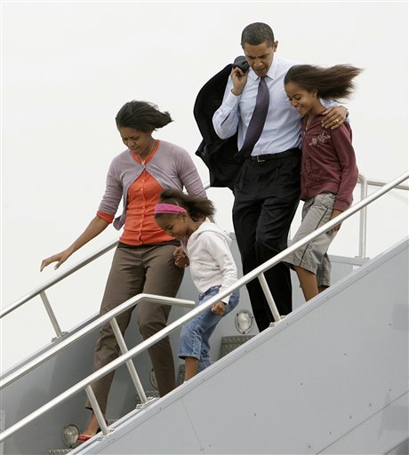 <b>With the family:</b> In this May 3, 2008 file photo American President Barack Obama, D-Ill., his wife Michelle and their two daughters Malia, top right, and Sasha arrive at the airport in Indianapolis. By early May, Obama's campaign was back on track after uproar over controversial comments by his former pastor, the Rev. Jeremiah Wright, and a controversial comment of his own about bitter small-town residents.