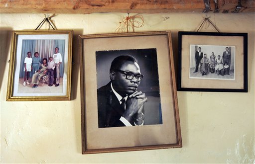 <b>Memories on wall:</b> In this February 5, 2008 file photo, a photograph of Barack Obama Sr., father of US President Barack Obama, D-Ill., hangs on the wall of his grandmother Sarah Hussein Obama's house in the village of Kogelo, near the shores of Lake Victoria, Kenya.