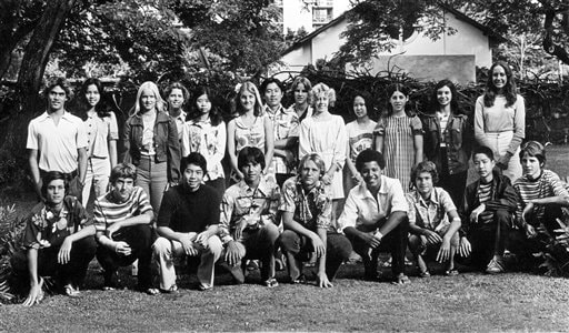 <b>Sitting together:</b> This 1976 photo provided by The Oahuan, the yearbook of Punahou School, shows Barack Obama, in front row, fourth from right, with his 9th grade class outside of Punahou School in Honolulu, Hawaii.