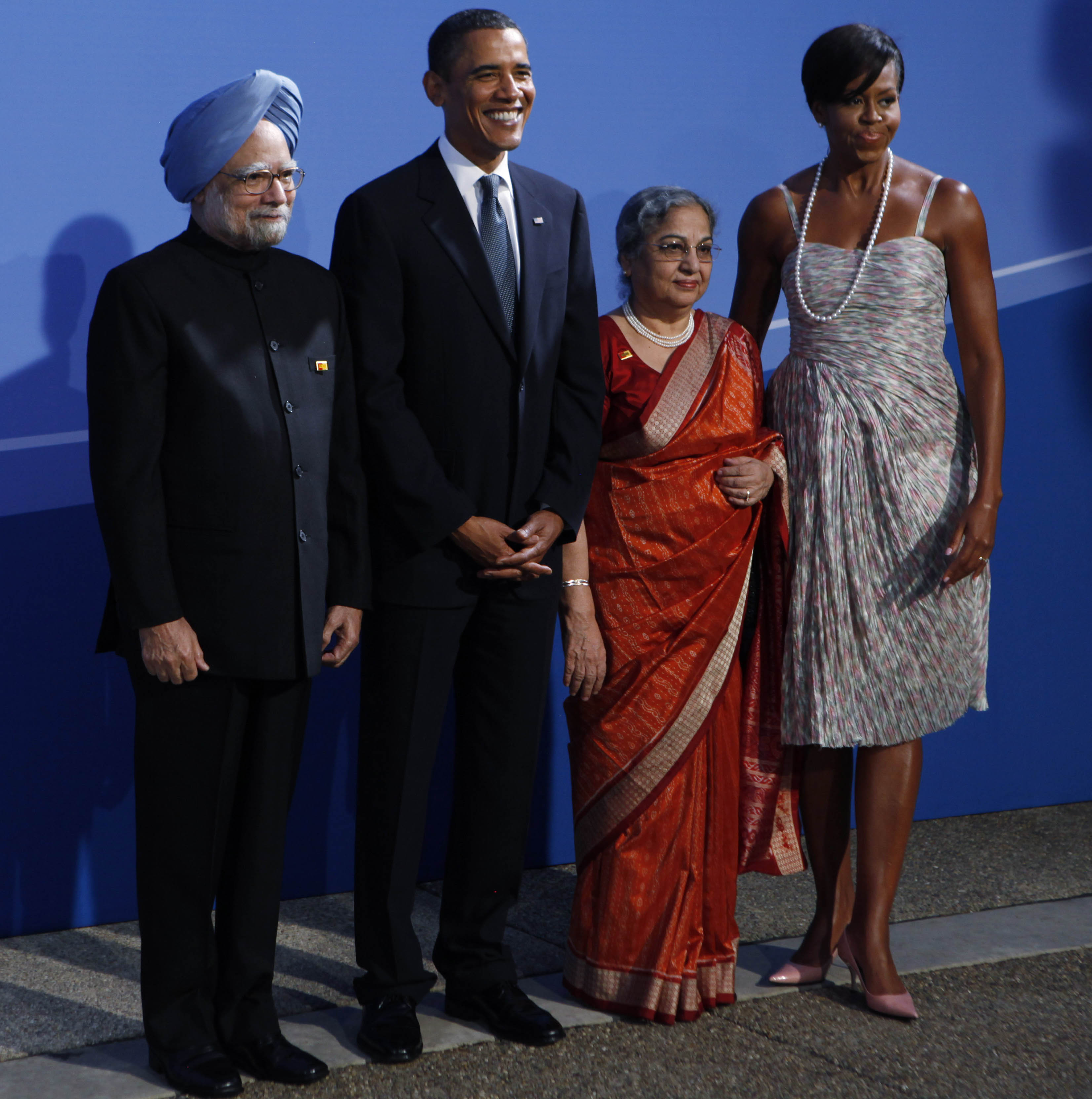 Prime Minister Manmohan Singh and wife Gursharan Kaur being welcomed by US President Barack Obama and First Lady Michelle Obama as they arrive for the G-20 summit dinner on September 24, 2009 in Pittsburgh. (AP Photo)