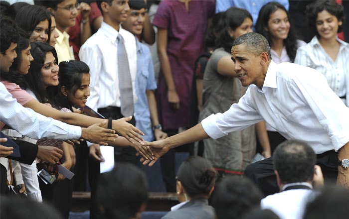 The Obamas were on a charm offensive, winning hearts upfront with their customary <i>namaste</i>.