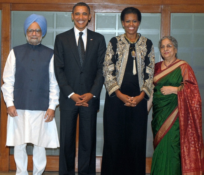 Prime Minister Manmohan Singh hosted a private dinner for visiting US President Barack Obama and his wife Michelle on Sunday which was attended by political bigwigs, business leaders, actors and sports personalities.
<br><br>
The Obamas drove to the 7, Race Course Road residence of the Prime Minister from ITC Maurya where they are staying. They were warmly welcomed by Singh and his wife Gursharan Kaur. (PTI Photo)