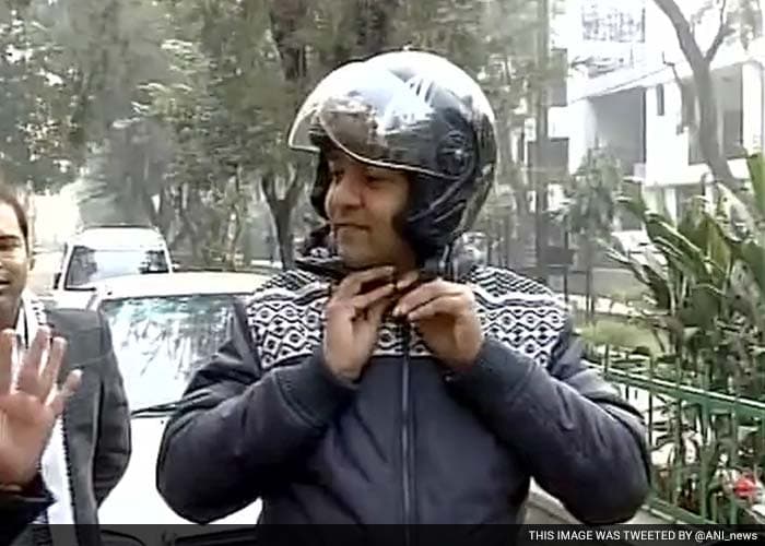 Delhi Tourism Minister Kapil Mishra leaves for Delhi Secretariat on a motorcycle.